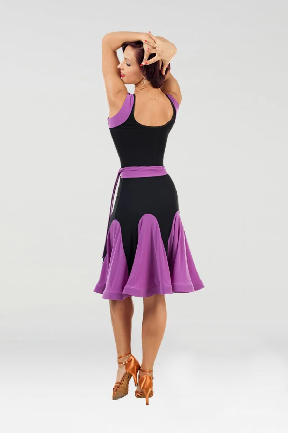 Back view of women's black and fuchsia Latin dancing dress